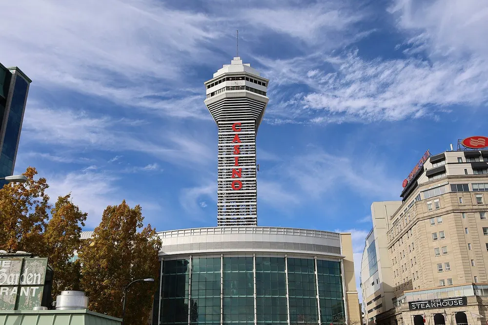 Casino Niagara on Falls Avenue: a round glass entrance building under a tall tower